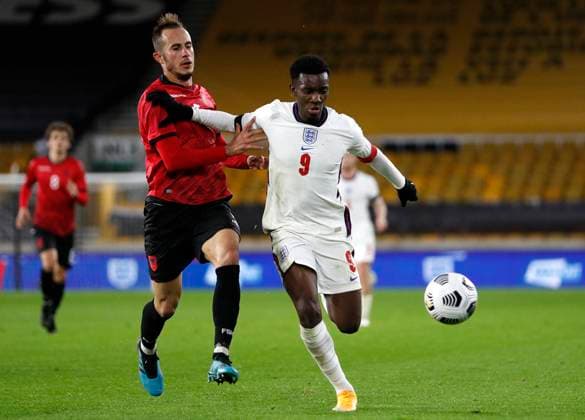 Elion Sota of Albania challenges Eddie Nketiah of England during the UEFA EURO, EM, Europameisterschaft,Fussball U21, U 21 Qualifying match at Molineux, Wolverhampton. Picture date: 17th November 2020. Picture credit should read: Darren Staples Sportimage EDITORIAL USE ONLY. No use with unauthorised audio, video, data, fixture lists, club league logos or live services. Online in-match use limited to 120 images, no video emulation. No use in betting, games or single club league player publications. SPI-0758-0092