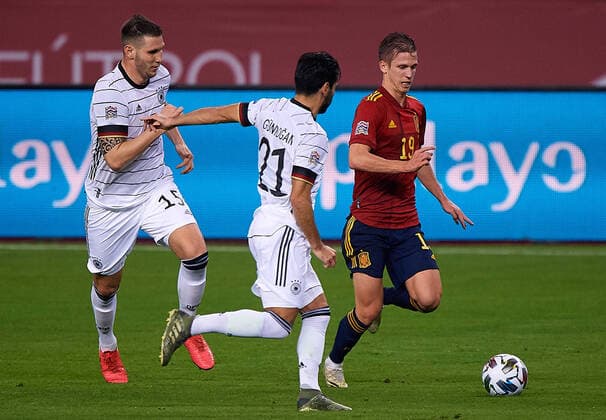 (201118) -- SEVILLE, Nov. 18, 2020 -- Dani Olmo (R) of Spain vies with Ilk Gundogan (C) and Niklas Sule (L) of Germany during the UEFA Nations League group match between Spain and Germany in Estadio La Cartuja in Seville, Spain, Nov. 17, 2020. (Photo by Pablo Morano Xinhua) (SP)SPAIN-SEVILLE-UEFA NATIONS LEAGUE-SPAIN VS GERMANY MengxDingbo 