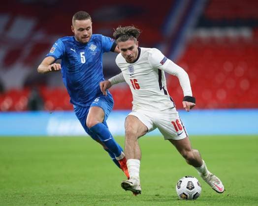 Jack Grealish of England runs through Sverrir Ingason of Iceland during the UEFA Nations League match at Wembley Stadium, London. Picture date: 18th November 2020. Picture credit should read: David Klein Sportimage EDITORIAL USE ONLY. No use with unauthorised audio, video, data, fixture lists, club league logos or live services. Online in-match use limited to 120 images, no video emulation. No use in betting, games or single club league player publications. SPI-0760-0060