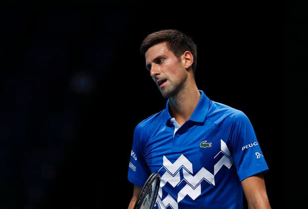 (201119) -- LONDON, Nov. 19, 2020 -- Novak Djokovic of Serbia looks dejected during the singles group match against Daniil Medvedev of Russia at the ATP, Tennis Herren World Tour Finals 2020 in London, Britain, on Nov. 18, 2020. ) (SP)BRITAIN-LONDON-TENNIS-ATP FINALS-DAY 4 HanxYan 