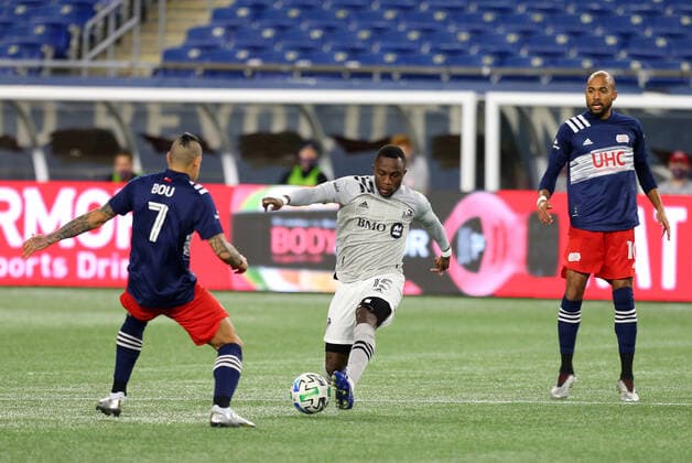 November 20, 2020; Foxborough, MA, USA; New England Revolution forward Gustavo Bou (7) and Montreal Impact defender Zachary Brault-Guillard (15) in action during the Eastern Conference Play-in round between Montreal Impact and New England Revolution at Gillette Stadium. CSM Foxborough United States - ZUMAc04_ 20201120_zaf_c04_006 Copyright: xAnthonyxNesmithx