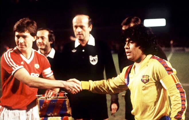 Football - 1983 1984 European Cup Winners Cup - Quarter-Final, Second Leg: Manchester United, ManU 3 (3) Barcelona 0 (2) at Old Trafford. 21 03 1984 The Two Captain Diego Maradona and Bryan Robson before kick off. Referee Paolo Casarin (Italy) Manchester United v Barcelona, European Cup Winners Cup, 21 03 1984. 