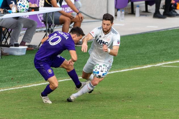 ORLANDO, USA, NOV 28TH Battle for the ball in the Major League Soccer Playoff match between Orlando City and New England at Exploria Stadium in Orlando *NO COMMERCIAL USAGE Stacy White SPP Orlando City v New England 