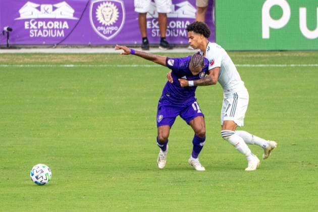ORLANDO, USA, NOV 28TH Battle for the ball in the Major League Soccer Playoff match between Orlando City and New England at Exploria Stadium in Orlando *NO COMMERCIAL USAGE Stacy White SPP Orlando City v New England 