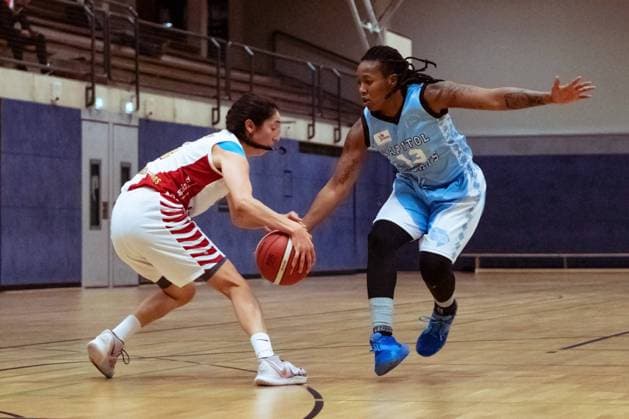 BERGISCH GLADBACH, GERMANY, DEC 2nd Rachel Theriot ( 3 Rheinland Lions)and Marquita Lashae Waller ( 13 Bascats) om action during the Toyota-DBBL-Cup game between the Rheinland Lions and the Capitol Bascats Düsseldorf at Schulzentrum Herkenrath, Bergisch Gladbach, Germany. T. HERZBERG Rheinland Lions vCapitol Bascats Düsseldorf 