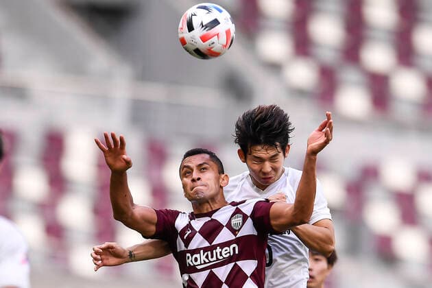 Brazilian professional footballer Dyanfres Douglas Chagas Matos, or simply Douglas, of Vissel Kobe, left, jumps for a head ball during the group match of 20 21 AFC Champions League (ACL) against Shanghai SIPG F.C., Doha city, Qatar, 7 December 2020. Vissel Kobe defeated Shanghai SIPG F.C. with 2-0.