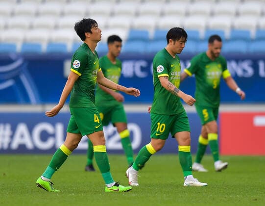 (201210) -- DOHA, Dec. 10, 2020 -- Li Lei (1st L) and Zhang Xizhe of Beijing Guoan FC react during the quarterfinal match between Beijing Guoan FC of China and Ulsan Hyundai FC of South Korea at the AFC Champions League in Doha, Qatar, Dec. 10, 2020. (Photo by Xinhua) (SP)QATAR-DOHA-FOOTBALL-AFC CHAMPIONS LEAGUE-ULSAN HYUNDAI-BEIJING GUOAN Nikku 