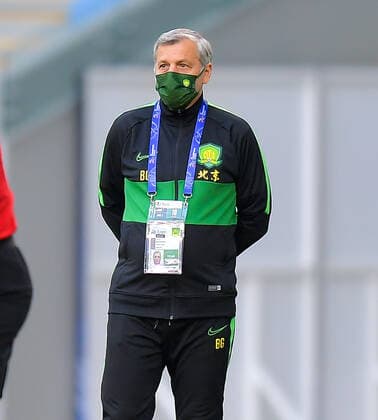 (201210) -- DOHA, Dec. 10, 2020 -- Bruno Genesio (R), head coach of Beijing Guoan, reacts during the quarterfinal match between Beijing Guoan FC of China and Ulsan Hyundai FC of South Korea at the AFC Champions League in Doha, Qatar, Dec. 10, 2020. (Photo by Xinhua) (SP)QATAR-DOHA-FOOTBALL-AFC CHAMPIONS LEAGUE-ULSAN HYUNDAI-BEIJING GUOAN Nikku 
