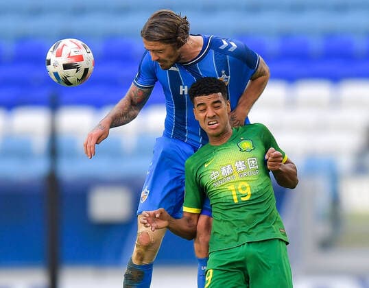(201210) -- DOHA, Dec. 10, 2020 -- Alan of Beijing Guoan FC vies with Dave Bulthuis (top) of Ulsan Hyundai FC during during the quarterfinal match between Beijing Guoan FC of China and Ulsan Hyundai FC of South Korea at the AFC Champions League in Doha, Qatar, Dec. 10, 2020. (Photo by Xinhua) (SP)QATAR-DOHA-FOOTBALL-AFC CHAMPIONS LEAGUE-ULSAN HYUNDAI-BEIJING GUOAN Nikku 