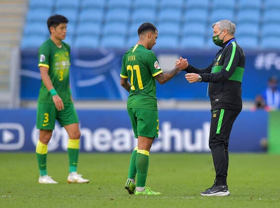 (201210) -- DOHA, Dec. 10, 2020 -- Bruno Genesio (R), head coach of Beijing Guoan, reacts with Jonathan Viera after the quarterfinal match between Beijing Guoan FC of China and Ulsan Hyundai FC of South Korea at the AFC Champions League in Doha, Qatar, Dec. 10, 2020. (Photo by Xinhua) (SP)QATAR-DOHA-FOOTBALL-AFC CHAMPIONS LEAGUE-ULSAN HYUNDAI-BEIJING GUOAN Nikku 