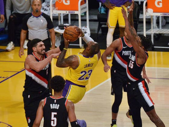Los Angeles Lakers LeBron James drives to the basket past four Portland Trail Blazers during the second half at Staples Center in Los Angeles on Monday, December 28, 2020. The Trail Blazers defeated the Lakers 115-107.  LAP2020122811 JIMxRUYMEN