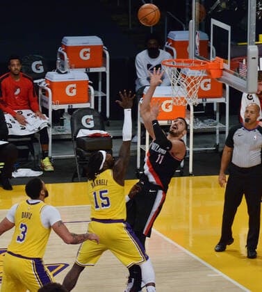 Portland Trail Blazers Enes Knter scores over Los Angeles Lakers Montrezi Harrell during the second half at Staples Center in Los Angeles on Monday, December 28, 2020. The Trail Blazers defeated the Lakers 115-107.  LAP2020122817 JIMxRUYMEN