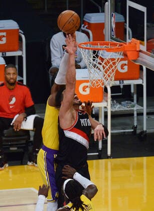 Portland Trail Blazers Enes Kanter scores past Los Angeles Lakers LeBron James during the second half at Staples Center in Los Angeles on Monday, December 28, 2020. The Trail Blazers defeated the Lakers 115-107.  LAP2020122812 JIMxRUYMEN
