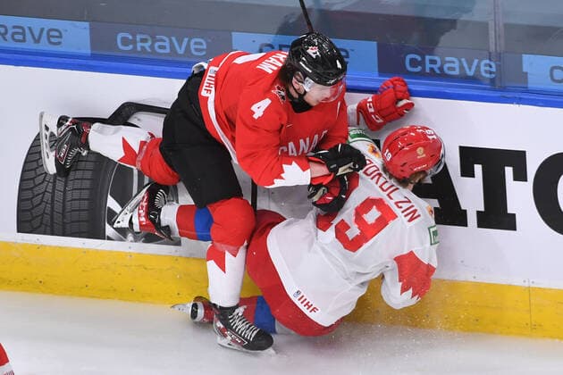 210105 Bowen Byram of Canada knocks Vasili Podkolzin of Russia to the ice during the 2021 IIHF World Junior Championship semifinal between Canada and Russia on January 4, 2021 in Edmonton. Photo: Andy Devlin BILDBYRAN COP 306 AD0008 bbeng ishockey Ice hockey, Eishockey jvm junior-vm u20 2021 iihf world junior championship world juniors semifinal canada kanada russia ryssland Copyright: ANDYxDEVLIN BB210105BB021