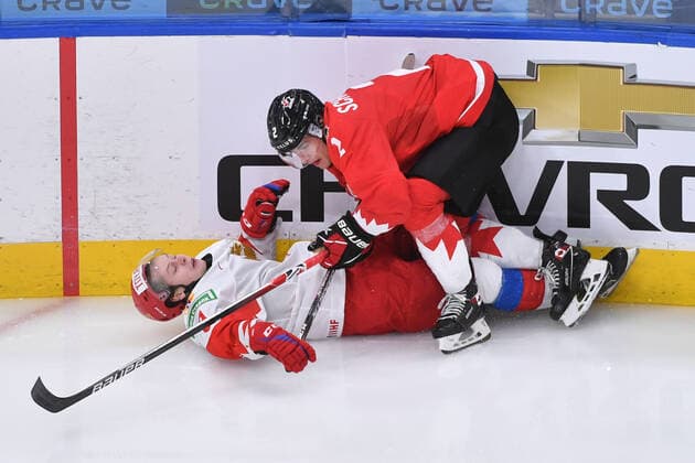 210105 Braden Schneider of Canada checks Mikhail Abramov of Russia to the ice during the 2021 IIHF World Junior Championship semifinal between Canada and Russia on January 4, 2021 in Edmonton. Photo: Andy Devlin BILDBYRAN COP 306 AD0008 bbeng ishockey Ice hockey, Eishockey jvm junior-vm u20 2021 iihf world junior championship world juniors semifinal canada kanada russia ryssland Copyright: ANDYxDEVLIN BB210105BB071
