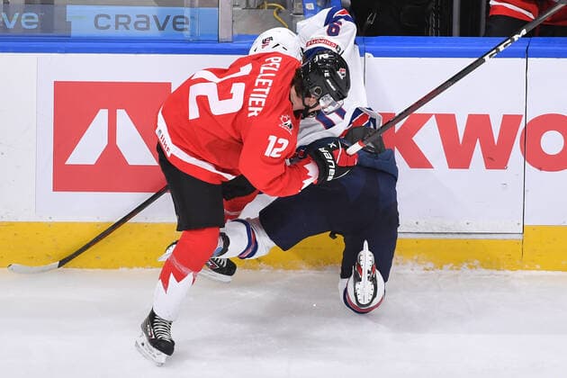 210106 Jakob Pelletier of Canada takes Trevor Zegras of USA hard into the boards during the 2021 IIHF World Junior Championship final between USA and Canada on January 6, 2021 in Edmonton. Photo: Andy Devlin BILDBYRAN COP 306 AD0012 bbeng ishockey Ice hockey, Eishockey jvm junior-vm u20 2021 iihf world junior championship world juniors final usa canada kanada Copyright: ANDYxDEVLIN BB210106BB080