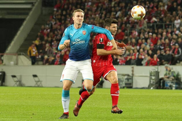 Koeln, Deutschland 23. November 2017: EL - 17 18 - 1. FC Koeln vs. FC Arsenal v. li. im Zweikampf Per Mertesacker (Arsenal) und Milos Jojic (Koeln) EL - 17 18 - 1. FC Koeln vs. FC Arsenal