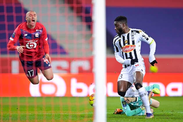 Burak Yilmaz (Losc) vs PAUL BERNARDONI (Angers) Ismael Traore (Angers) FOOTBALL : LOSC vs Angers - Ligue1 Uber eats - 06 01 2021 JBAutissier Panoramic 