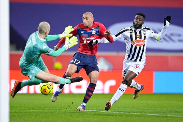 Burak Yilmaz (Losc) vs PAUL BERNARDONI (Angers) Ismael Traore (Angers) FOOTBALL : LOSC vs Angers - Ligue1 Uber eats - 06 01 2021 JBAutissier Panoramic 