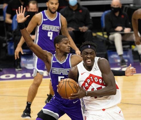 January 8, 2021, Sacramento, CA, USA: Toronto Raptors forward Pascal Siakam (43) drives past Sacramento Kings guard De Aaron Fox (5) during a game at the Golden 1 Center on Friday, Jan 8, 2021 in Sacramento. Sacramento USA - ZUMAj89_ 20210108_zaf_j89_010 Copyright: xPaulxKitagakixJr.x