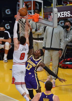 Chicago Bulls Zach Lavine is fouled by Los Angeles Lakers Dennis Schroder as he scores a basket during the fourth quarter at Staples Center in Los Angeles on Friday, January 8, 2021. The Lakers defeated the Bulls 117-115.  LAP2021010805 JIMxRUYMEN