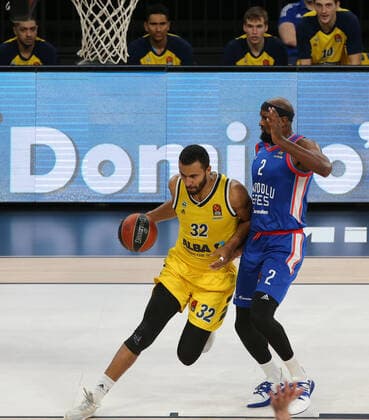 Chris Singleton (2) of Anadolu Efes and Johannes Thiemann (32) of Alba Berlin during the Turksih Airlines Euroleague Basketball match between Anadolu Efes and Alba Berlin at Sinan Erdem Arena in Istanbul , Turkey on January 12 , 2021. 