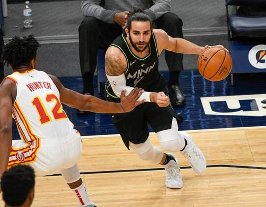 Minnesota Timberwolves guard Ricky Rubio (R) drives past Atlanta Hawks forward De Andre HunterÃŠ(L) during the first half of their NBA, Basketball Herren, USA basketball game between the Atlanta Hawks and the Minnesota Timberwolves at Target Center in Minneapolis, Minnesota, USA, 22 January, 2021. Atlanta Hawks at Minnesota Timberwolves !ACHTUNG: NUR REDAKTIONELLE NUTZUNG!  Copyright: xCRAIGxLASSIGx AME847 20210123-637469686914349420