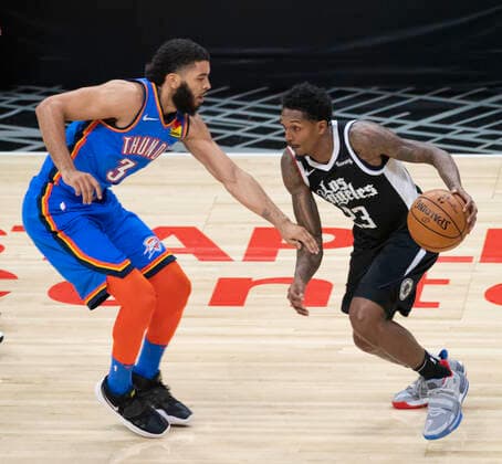 LOS ANGELES, CA - JANUARY 24: Los Angeles Clippers Oklahoma City Thunder Guard George Hill (3) defends Guard Lou Williams (23) during an NBA, Basketball Herren, USA game between the Los Angeles Clippers and the Oklahoma City Thunder and the on January 24, 2021 at STAPLES Center in Los Angeles, CA. (Photo by Carrie Giordano Icon Sportswire) NBA: JAN 24 Thunder at Clippers Icon210124003