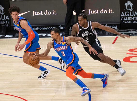 LOS ANGELES, CA - JANUARY 24: Oklahoma City Thunder Guard George Hill (3) breaks past Los Angeles Clippers Forward Kawhi Leonard (2) during an NBA, Basketball Herren, USA game between the Los Angeles Clippers and the Oklahoma City Thunder and the on January 24, 2021 at STAPLES Center in Los Angeles, CA. (Photo by Carrie Giordano Icon Sportswire) NBA: JAN 24 Thunder at Clippers Icon210124009
