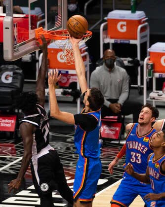 LOS ANGELES, CA - JANUARY 24: Oklahoma City Thunder Center Aleksej Pokusevski (17) rebounds the ball during an NBA, Basketball Herren, USA game between the Los Angeles Clippers and the Oklahoma City Thunder and the on January 24, 2021 at STAPLES Center in Los Angeles, CA. (Photo by Carrie Giordano Icon Sportswire) NBA: JAN 24 Thunder at Clippers Icon210124025