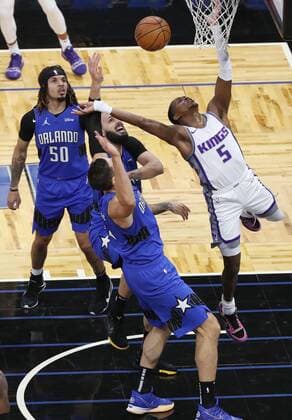 January 27, 2021, Orlando, Florida, USA: Orlando Magic defenders Coley Anthony (50), Evan Fournier, middle, and Nikola Vucevic, bottom, try to stop the Sacramento Kings De Aaron Fox (5) during the first half at the Amway Center in Orlando, Florida, on Wednesday, Jan. 27, 2021. The Kings won, 121-107. Orlando USA - ZUMAm67_ 0111219839st Copyright: xStephenxM.xDowellx