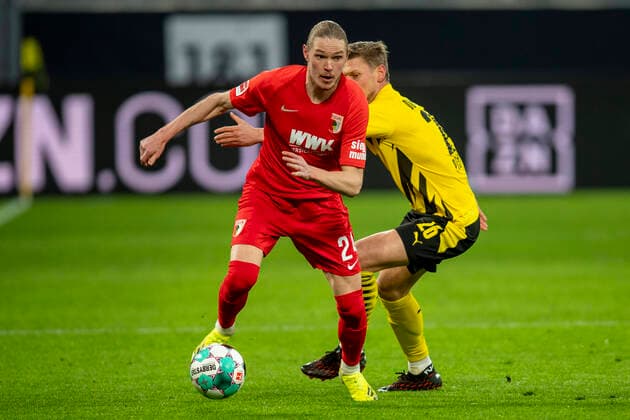 1. Bundesliga: Borussia Dortmund - FC Augsburg Fußball: 1. Bundesliga, Saison 2020 2021, 19. Spieltag, Borussia Dortmund - FC Augsburg am 30.01.2021 im Signal-Iduna-Park in Dortmund (Nordrhein-Westfalen). Augsburgs Fredrik Jensen (l) und Dortmunds Lukasz Piszczek kämpfen um den Ball. DFL REGULATIONS PROHIBIT ANY USE OF PHOTOGRAPHS AS IMAGE SEQUENCES AND OR QUASI-VIDEO. Editorial Use ONLY National and International News Agencies OUT Dortmund Signal-Iduna-Park Nordrhein-Westfalen Deutschland *** 1 Bundesliga Borussia Dortmund FC Augsburg Football 1 Bundesliga, season 2020 2021, matchday 19, Borussia Dortmund FC Augsburg on 30 01 2021 at Signal Iduna Park in Dortmund North Rhine Westphalia Augsburgs Fredrik Jensen l and Dortmunds Lukasz Piszczek battle for the ball DFL REGULATIONS PROHIBIT ANY USE OF PHOTOGRAPHS AS IMAGE SEQUENCES AND OR QUASI VIDEO Editorial Use ONLY National and International News Agencies OUT Dortmund Signal Iduna Park North Rhine Westphalia Germany Poolfoto David Inderlied Kirchner-Media pool ,EDITORIAL USE ONLY