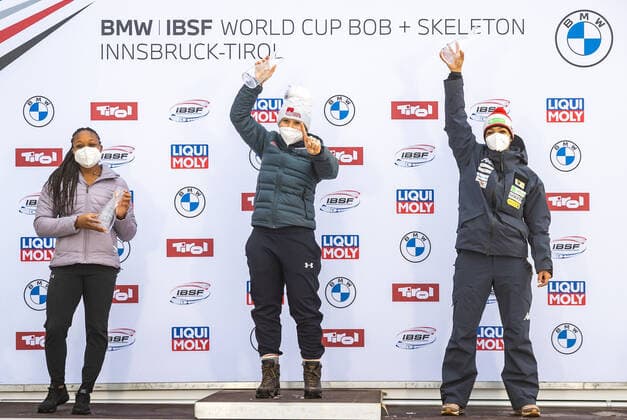 31.01.2021, Olympia Eiskanal, Innsbruck, AUT, BMW IBSF Weltcup Bob, Igls, Damen Zweierbob, Siegerehrung, im Bild v.l. Elana Meyers Taylor (USA, 2. Platz), Kaillie Humphries (USA, 1 Platz), J.J.O.D. Onasanya (AUT, 3. Platz) left to right: second placed Elana Meyers Taylor of the USA winner Kaillie Humphries of the USA third placed J.J.O.D. Onasanya of Austria during the winner ceremony for the women doubles Bobsleigh competition of BMW IBSF World Cup at the Olympia Eiskanal in Innsbruck, Austria on 2021 01 31.