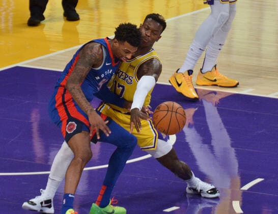 Los Angeles Lakers point guard Dennis Schroder slaps the ball away from Detroit Pistons guard Delon Wright during the third quarter at Staples Center in Los Angeles on Saturday, February 6, 2021. The Lakers defeated the Pistons 135-129 in double-overtime.  LAP2021020640 JIMxRUYMEN
