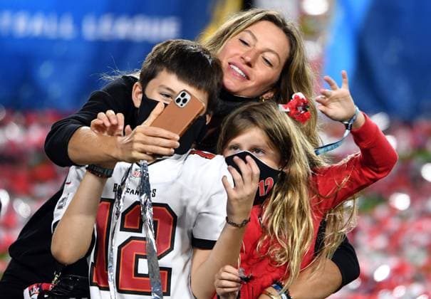Gisele Bundchen, the wife of Tampa Bay Buccaneers quarterback Tom Brady, takes a selfie photograph with their children Benjamin and Vivian, after the Buccaneers won Super Bowl LV, defeating the Kansas City Chiefs 31-9, at Raymond James Stadium in Tampa, Florida on Sunday, February 7, 2021.  SBP20210207902 DENISxCOOK