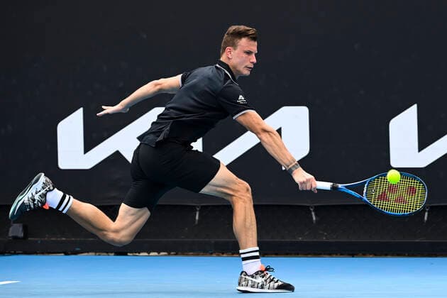 TENNIS AUSTRALIAN OPEN, Marton Fucsovics of Hungary in action during his first Round Men s singles match against Marc Polmans of Australia on Day 1 of the Australian Open at Melbourne Park in Melbourne, Monday, February 8, 2021. ( NO ARCHIVING, EDITORIAL USE ONLY, NO USE IN BOOKS WITHOUT CONSENT MELBOURNE VIC AUSTRALIA  Copyright: xDAVExHUNTx 20210208001519126179