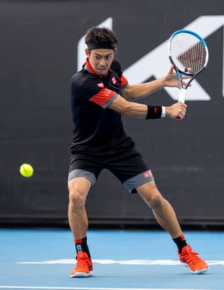 MELBOURNE, VIC - FEBRUARY 08: Kei Nishikori of Japan returns the ball during round 1 of the 2021 Australian Open on February 8 2020, at Melbourne Park in Melbourne, Australia. (Photo by Jason Heidrich Icon Sportswire) TENNIS: FEB 08 Australian Open Icon2102081981