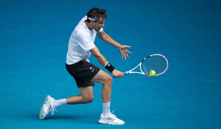 (210208) -- MELBOURNE, Feb. 8, 2021 -- Dominic Thiem returns a shot during the men s singles first round match between Dominic Thiem of Austria and Mikhail Kukushkin of Kazakhstan in Melbourne Park, Melbourne, Australia on Feb. 8, 2021. (Photo by Xinhua) (SP)AUSTRALIA-MELBOURNE-TENNIS-AUSTRALIAN OPEN HuxJingchen 