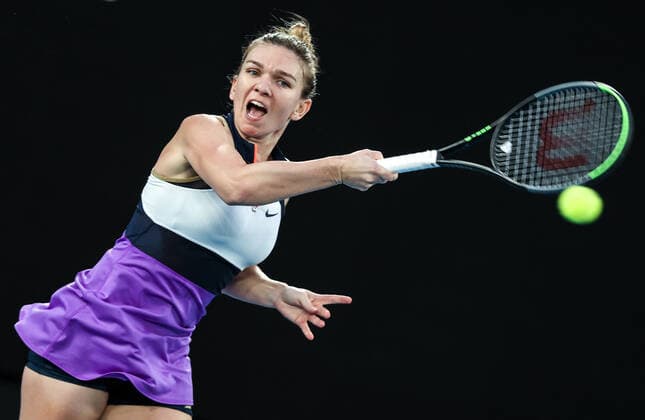 (210208) -- MELBOURNE, Feb. 8, 2021 -- Simona Halep of Romania hits a return during the women s singles first round match against Lizette Cabrera of Australia at the Australian Open tennis championship in Melbourne, Australia, Feb. 8, 2021. ) (SP)AUSTRALIA-MELBOURNE-TENNIS-AUSTRALIAN OPEN-DAY 1 BaixXuefei 
