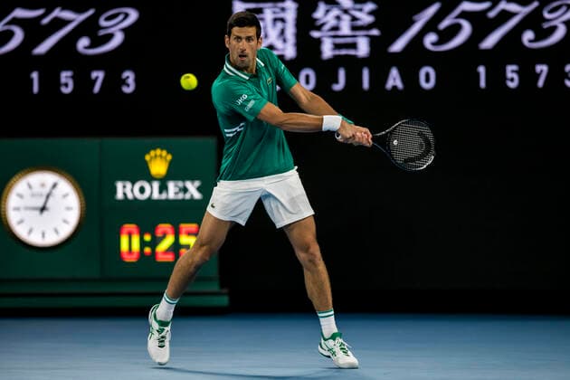 MELBOURNE, VIC - FEBRUARY 08: Novak Djokovic of Serbia returns the ball during round 1 of the 2021 Australian Open on February 8 2020, at Melbourne Park in Melbourne, Australia. (Photo by Jason Heidrich Icon Sportswire) TENNIS: FEB 08 Australian Open Icon2102082821