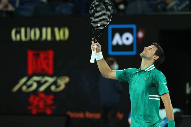 (210208) -- MELBOURNE, Feb. 8, 2021 -- Novak Djokovic of Serbia celebrates after winning the men s singles first round match against Jeremy Chardy of France at the Australian Open tennis championship in Melbourne, Australia, Feb. 8, 2021. (Photo by Hu Jingchen Xinhua) (SP)AUSTRALIA-MELBOURNE-TENNIS-AUSTRALIAN OPEN-DAY 1 BaixXuefeihujingchen 