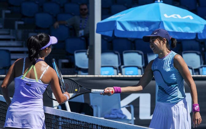 (210209) -- MELBOURNE, Feb. 9, 2021 -- Zhang Shuai (R) of China greets with Ann Li of the United States after the women s singles first round match between Zhang Shuai of China and Ann Li of the United States at Australian Open in Melbourne Park, Melbourne, Australia on Feb. 9, 2021. ) (SP)AUSTRALIA-MELBOURNE-TENNIS-AUSTRALIAN OPEN-DAY 2 BaixXuefei 
