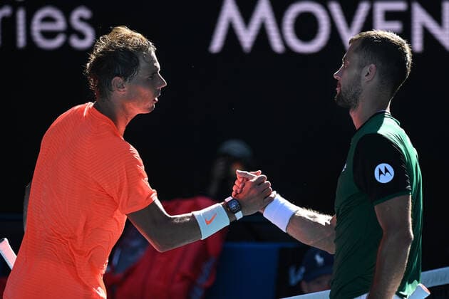 TENNIS AUSTRALIAN OPEN, Rafael Nadal of Spain shakes hands with Laslo Djere of Serbia after his first Round win in his Men s singles match against Laslo Djere of Serbia on Day 2 of the Australian Open at Melbourne Park in Melbourne, Tuesday, February 9, 2021. ( NO ARCHIVING, EDITORIAL USE ONLY, NO USE IN BOOKS WITHOUT CONSENT MELBOURNE VIC AUSTRALIA  Copyright: xDEANxLEWINSx 20210210001519388990