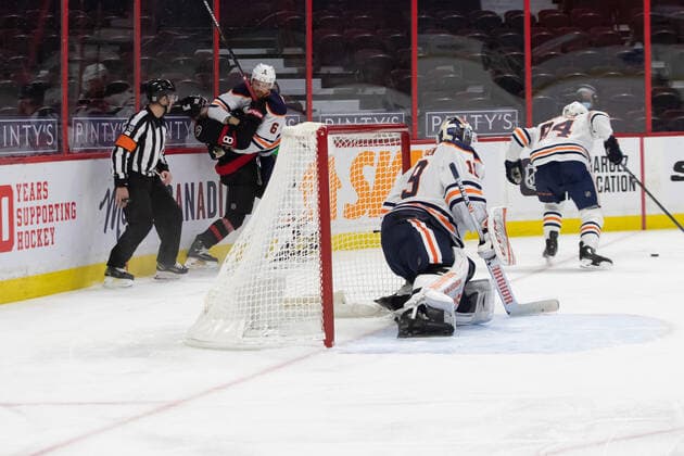 February 09, 2021: Edmonton Oilers Adam Larsson (6) elbows Ottawa Senators Tim Stutzle (18) while Referee Kendrick Nicholson (30) looks on during the NHL, Eishockey Herren, USA game between the Edmonton Oilers and the Ottawa Senators at Canadian Tire Centre in Ottawa, Canada. CSM Ottawa Canada - ZUMAc04_ 20210209_zaf_c04_067 Copyright: xDanielxLeax