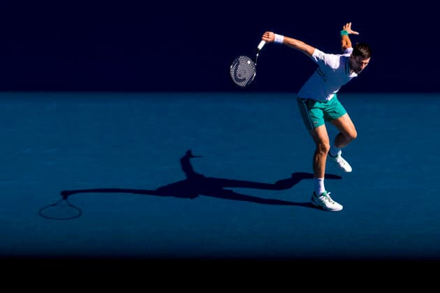 MELBOURNE, VIC - FEBRUARY 10: Novak Djokovic of Serbia returns the ball during round 2 of the 2021 Australian Open on February 10 2020, at Melbourne Park in Melbourne, Australia. (Photo by Jason Heidrich Icon Sportswire) TENNIS: FEB 10 Australian Open Icon2102101273