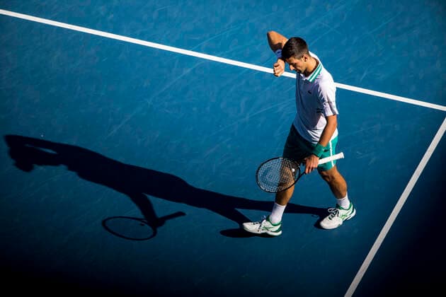 MELBOURNE, VIC - FEBRUARY 10: Novak Djokovic of Serbia wipes sweat from his forehead during round 2 of the 2021 Australian Open on February 10 2020, at Melbourne Park in Melbourne, Australia. (Photo by Jason Heidrich Icon Sportswire) TENNIS: FEB 10 Australian Open Icon2102101373