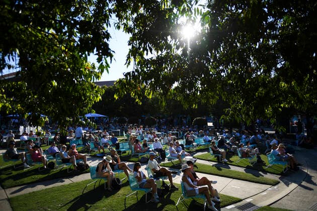 TENNIS AUSTRALIAN OPEN, Visitors watch a tennis match on a screen on Day 3 of the Australian Open at Melbourne Park in Melbourne, Wednesday, February 10, 2021. ( NO ARCHIVING, EDITORIAL USE ONLY, NO USE IN BOOKS WITHOUT CONSENT MELBOURNE VIC AUSTRALIA  Copyright: xDEANxLEWINSx 20210210001519571156