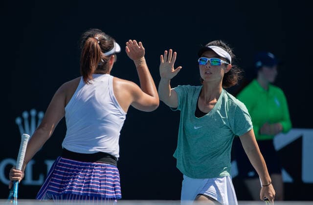 (210210) -- MELBOURNE, Feb. 10, 2021 -- Yang Zhaoxuan Xu Yifan (R) react during the women s doubles first round match between Yang Zhaoxuan Xu Yifan of China and Russia s Anastasia Pavlyuchenkova Latvia s Anastasija Sevastova at the Australian Open in Melbourne Park, Melbourne, Australia on Feb. 10, 2021. (Photo by Hu Jingchen Xinhua) (SP)AUSTRALIA-MELBOURNE-TENNIS-AUSTRALIAN OPEN-DAY 3 BaixXuefeihujingchen 