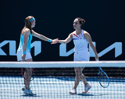 (210210) -- MELBOURNE, Feb. 10, 2021 -- Aleksandra Krunic (L) Martina Trevisan react during the women s doubles first round match between China s Zheng Saisai Duan Yingying and Serbia s Aleksandra Krunic Italy s Martina Trevisan at the Australian Open in Melbourne Park, Melbourne, Australia on Feb. 10, 2021. (Photo by Xinhua) (SP)AUSTRALIA-MELBOURNE-TENIS-AUSTRALIAN OPEN-DAY 3 HuxJingchen 