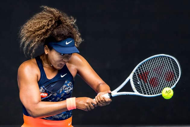 MELBOURNE, VIC - FEBRUARY 14: Naomi Osaka of Japan returns the ball during round 4 of the 2021 Australian Open on February 14 2020, at Melbourne Park in Melbourne, Australia. (Photo by Jason Heidrich Icon Sportswire) TENNIS: FEB 14 Australian Open Icon2102140187